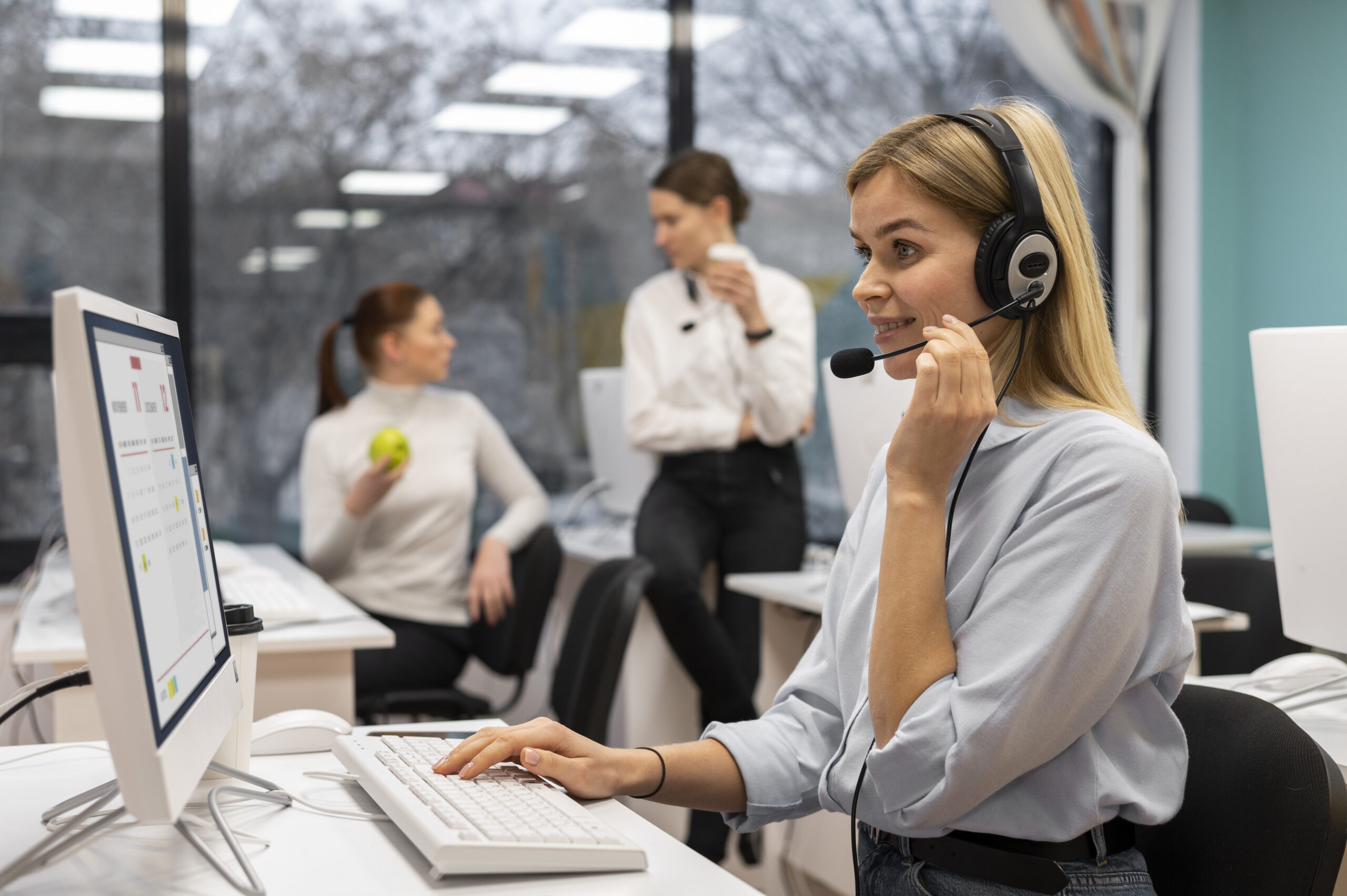 woman-working-call-center-talking-with-clients-using-headphones-microphone